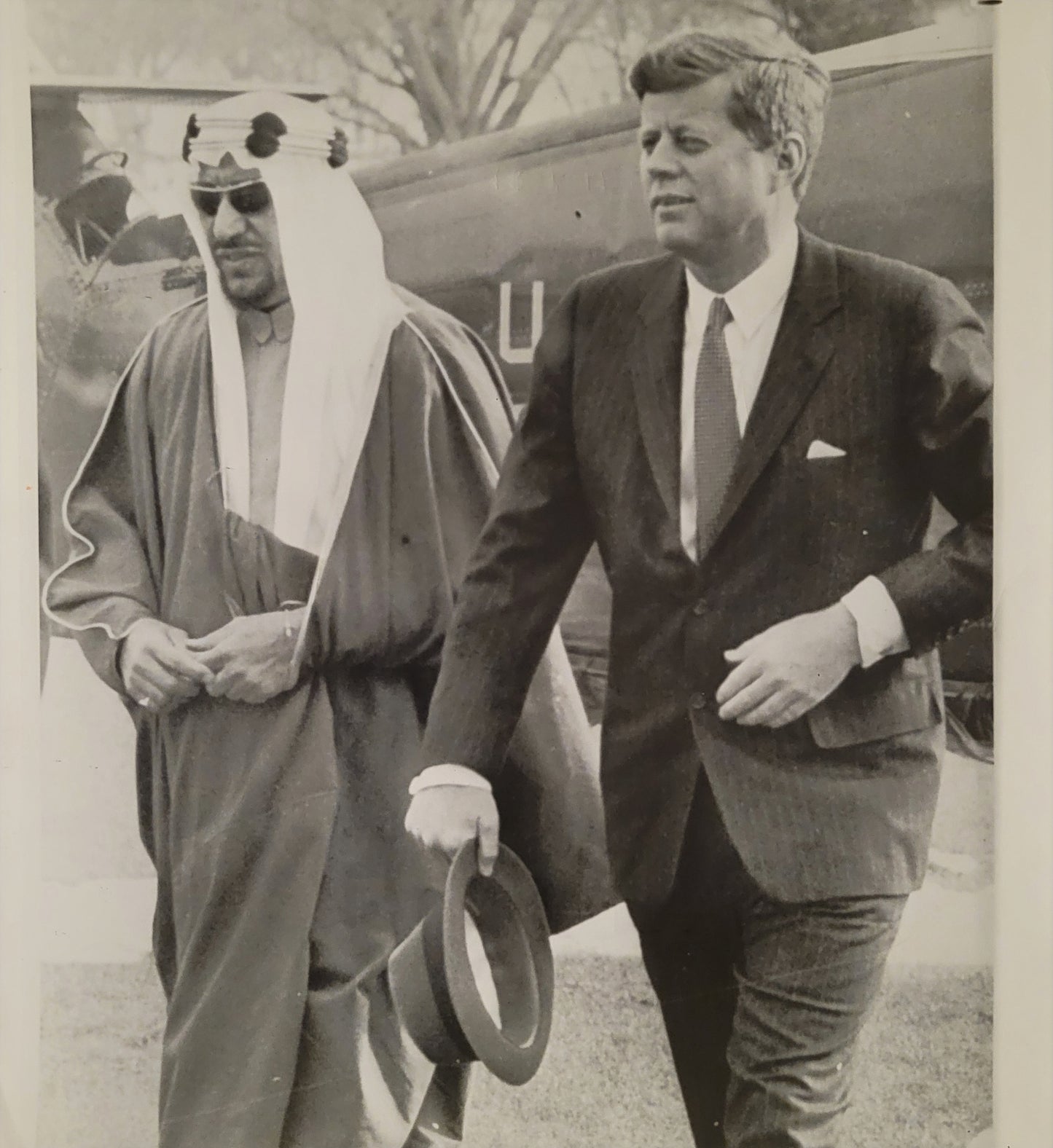 President Kennedy with Saudi King Saud, exiting helicopter on White House lawn. 1962.