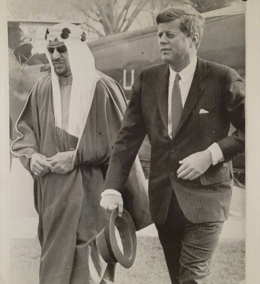 President Kennedy with Saudi King Saud, exiting helicopter on White House lawn. 1962.